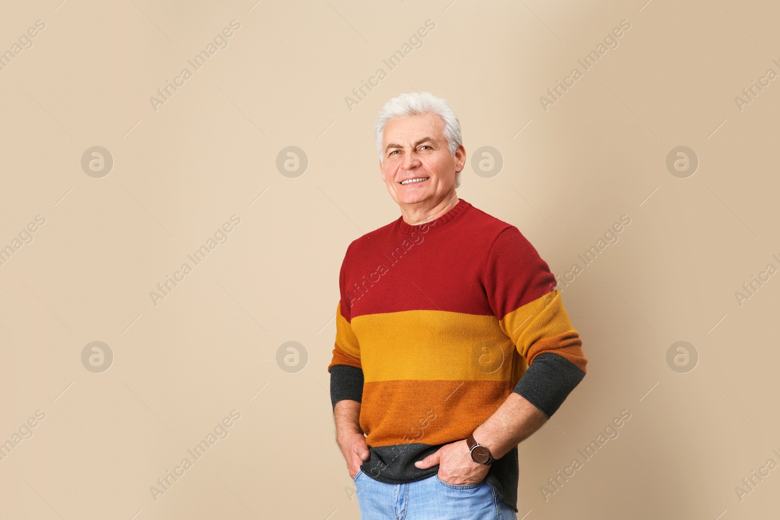 Photo of Portrait of handsome mature man on color background. Space for text