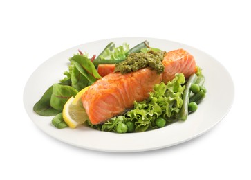 Tasty cooked salmon with pesto sauce and fresh salad on white background