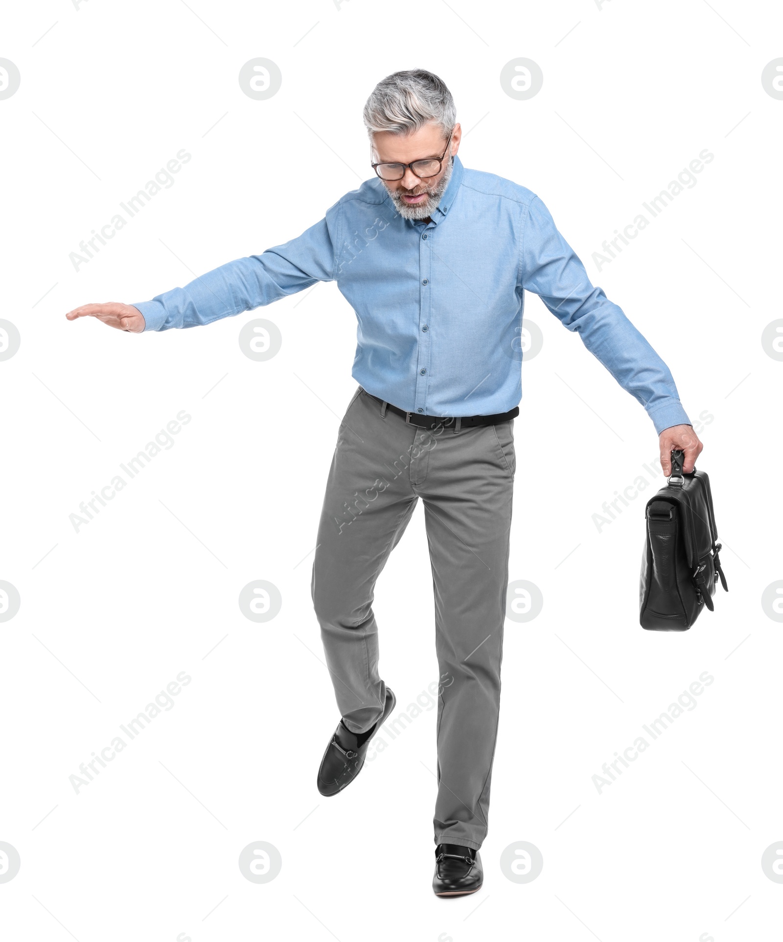 Photo of Mature businessman in stylish clothes with briefcase on white background