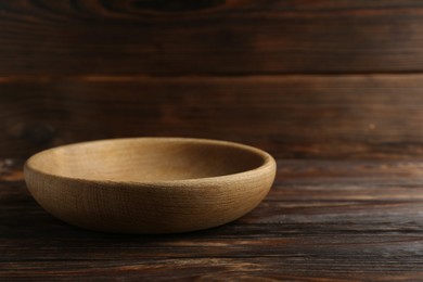 Beautiful bowl on wooden table, space for text