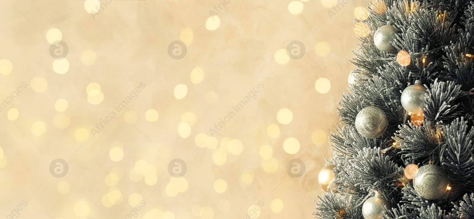 Image of Greeting card design. Beautiful decorated Christmas tree against blurred fairy lights, space for text