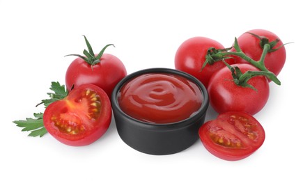 Photo of Bowl with tasty ketchup, parsley and fresh tomatoes isolated on white