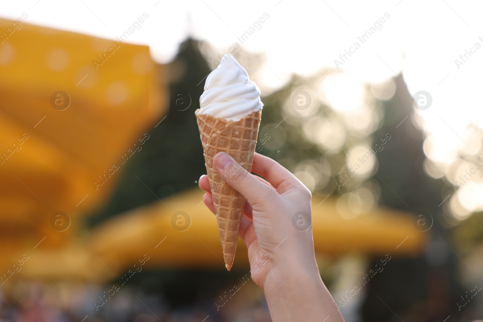 Photo of Lviv, Ukraine - September 26, 2023: Woman with McDonald's ice cream outdoors, closeup