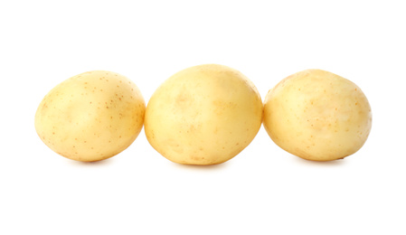 Photo of Fresh raw organic potatoes on white background