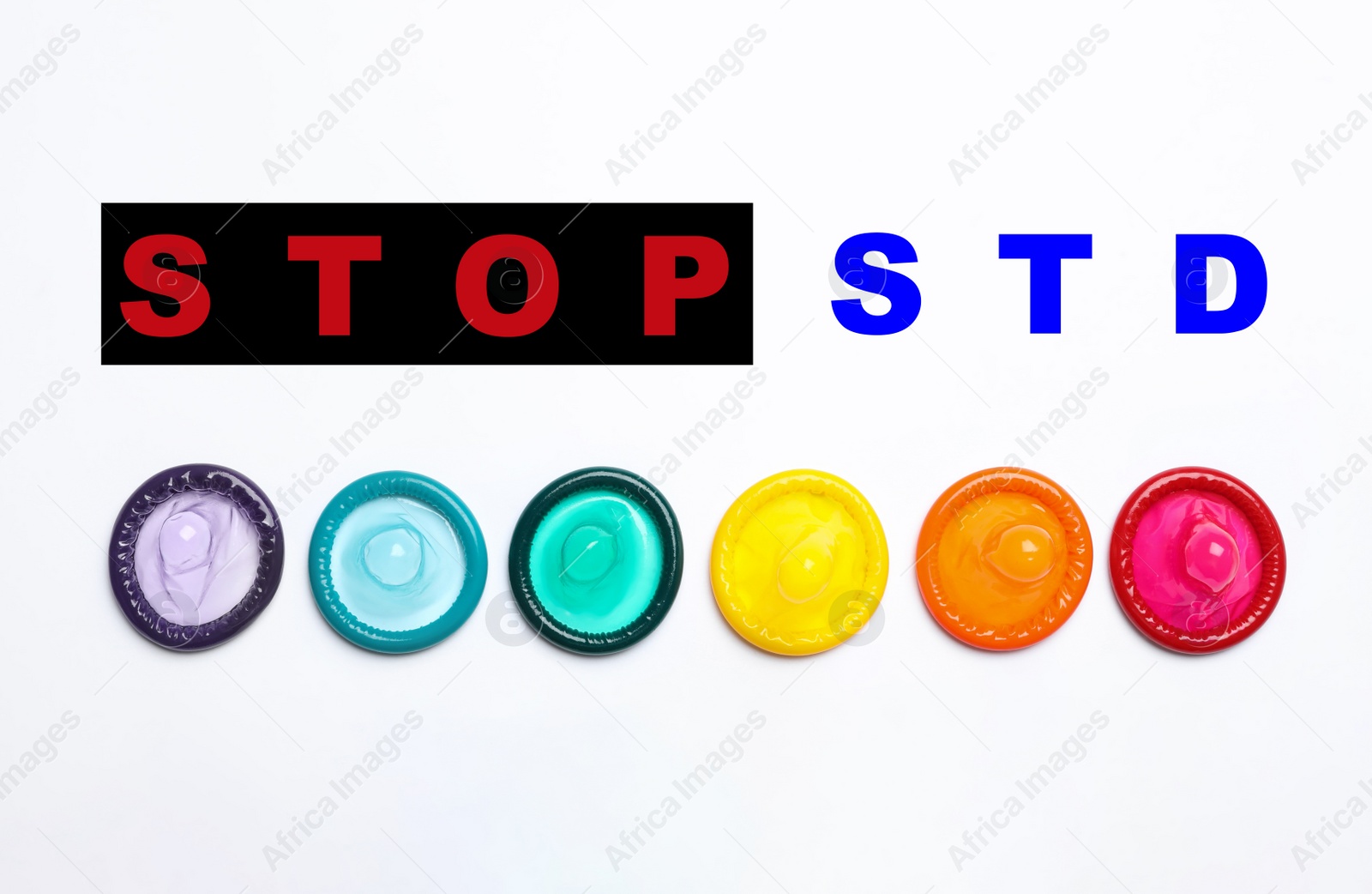 Image of Colorful condoms and text STOP STD on white background, flat lay