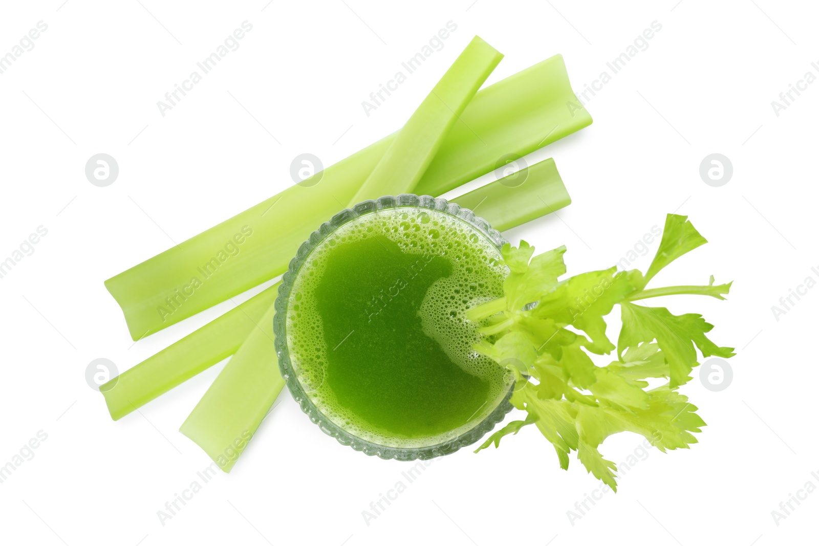 Photo of Glass of celery juice and fresh vegetable on white background, top view