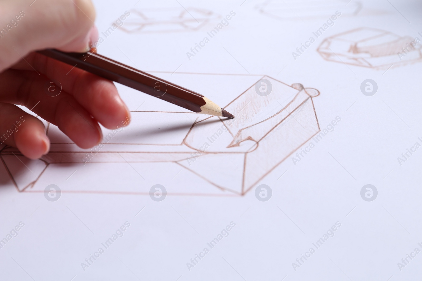 Photo of Woman creating packaging design on paper, closeup