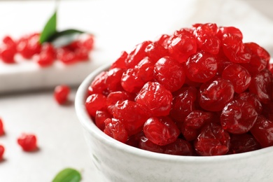 Bowl of sweet cherries on table, closeup. Dried fruit as healthy snack