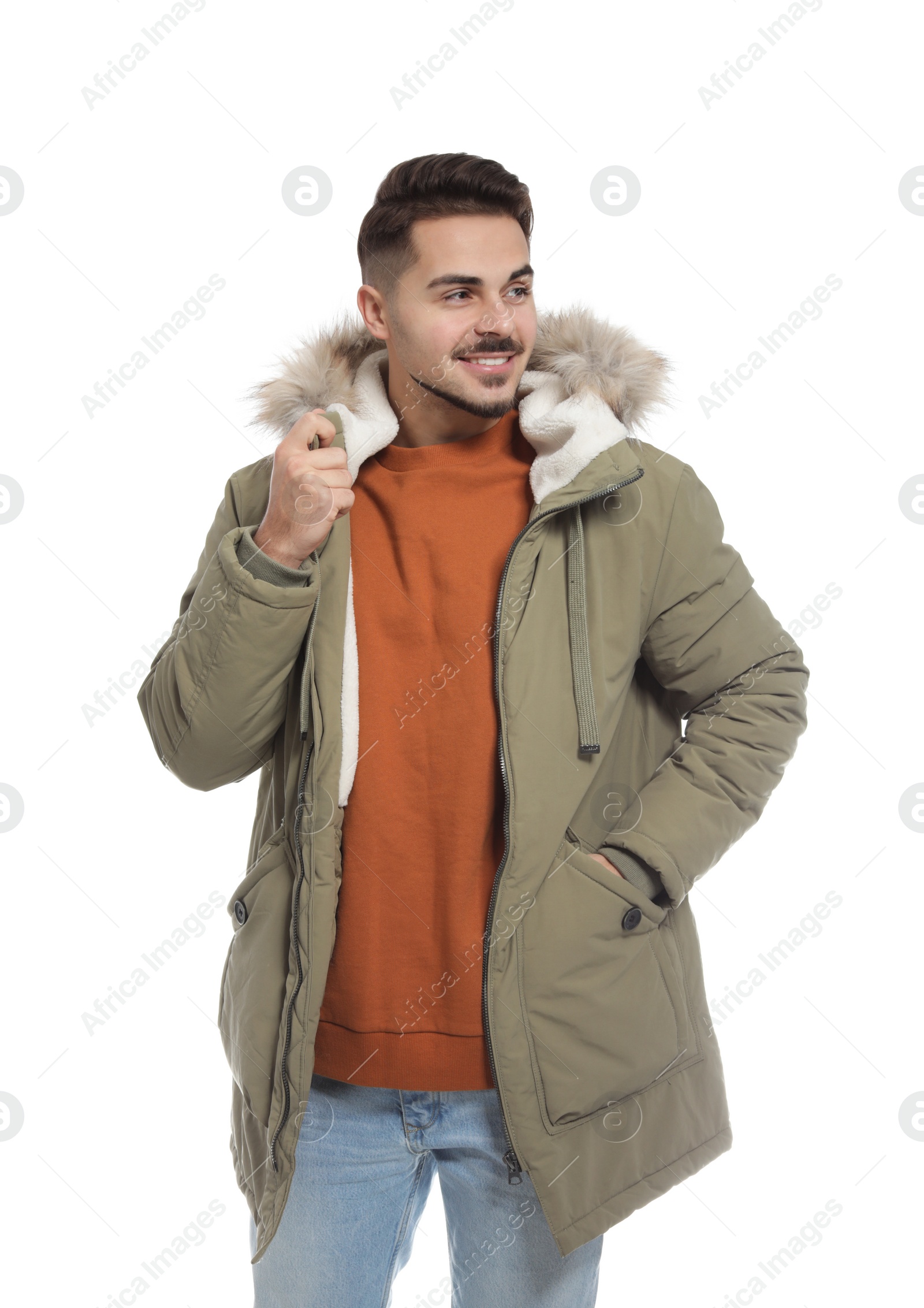 Photo of Young man wearing warm clothes on white background. Ready for winter vacation