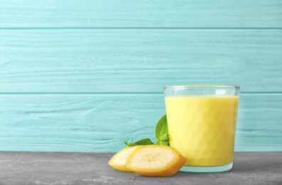 Photo of Glass with delicious detox smoothie on table