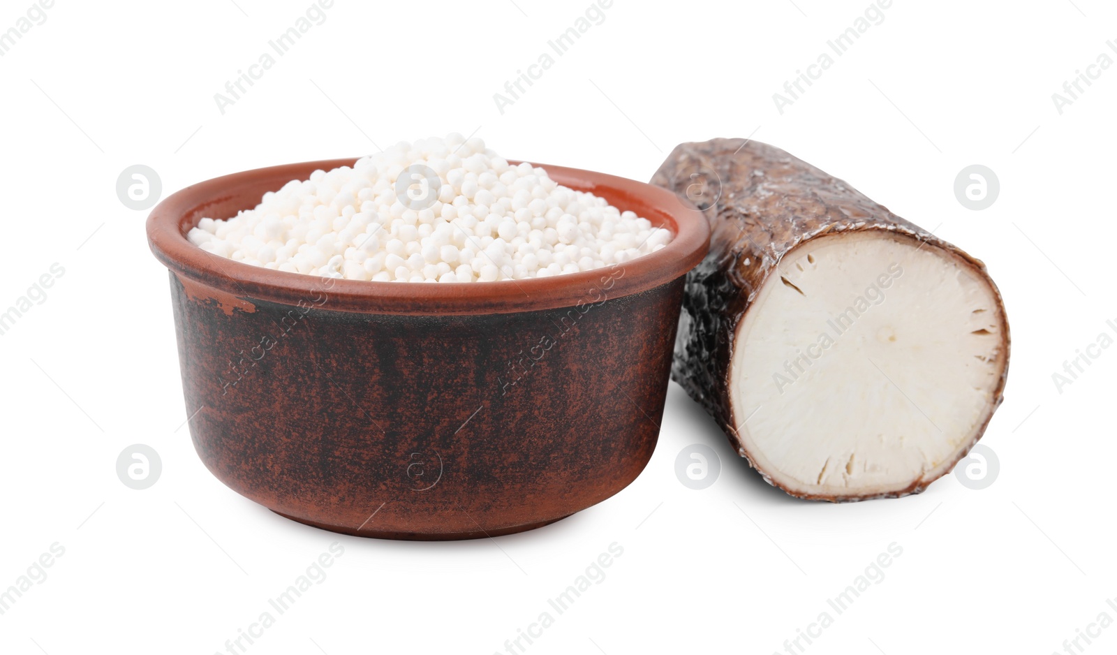 Photo of Tapioca pearls in bowl and cassava root isolated on white