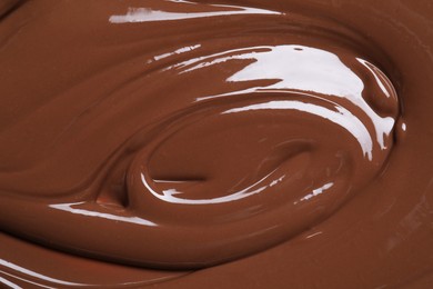 Photo of Tasty chocolate paste as background, closeup view