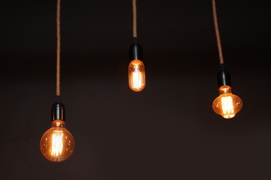 Photo of Lamp bulbs in darkness. Interior element