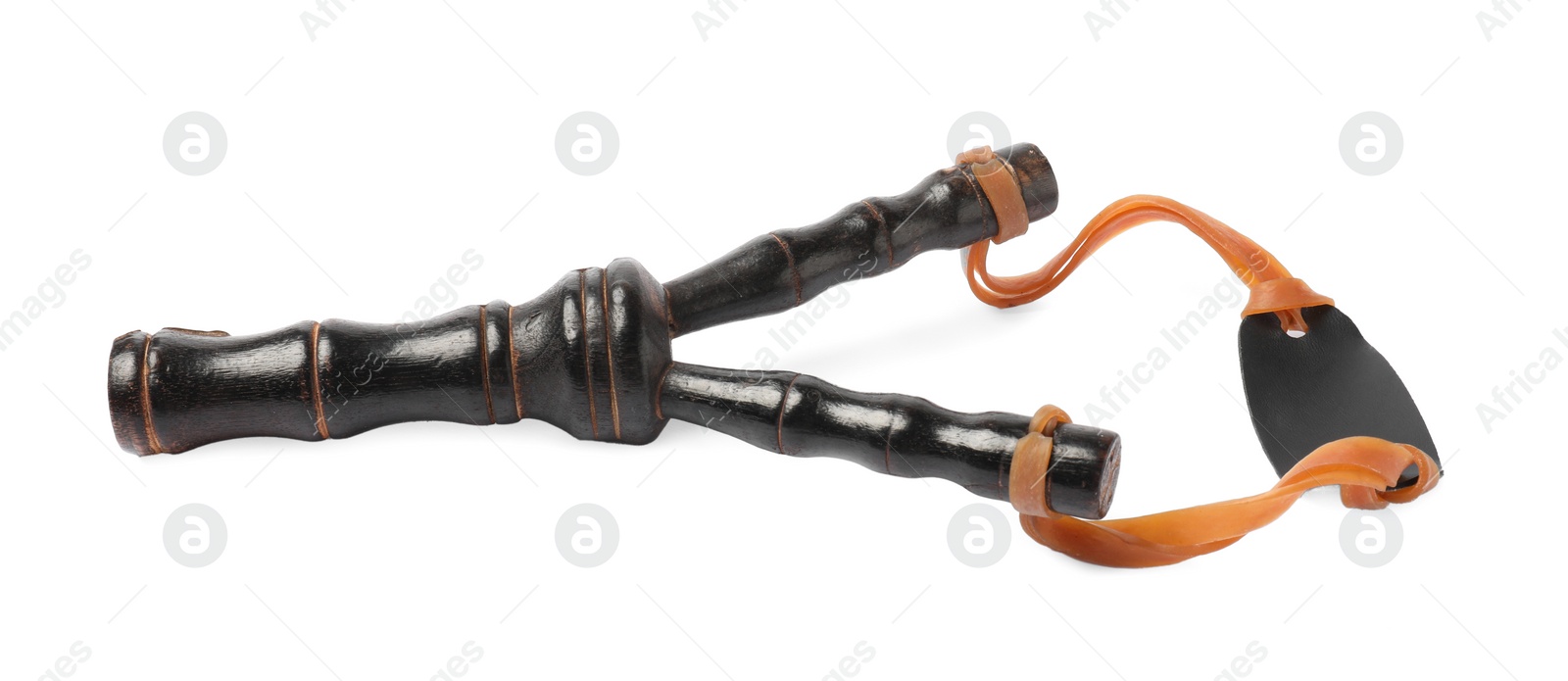 Photo of Black wooden slingshot with leather pouch on white background