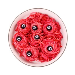 Red pasta with decorative eyes and olives in bowl isolated on white, top view. Halloween food