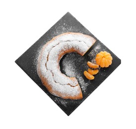 Delicious homemade yogurt cake with powdered sugar and tangerines on white background, top view