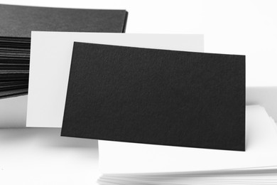 Photo of Business cards on white background, closeup. Mockup for design