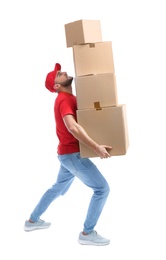 Photo of Full length portrait of man in uniform carrying boxes on white background. Posture concept
