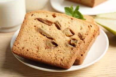 Tasty pear bread on wooden table, closeup. Homemade cake