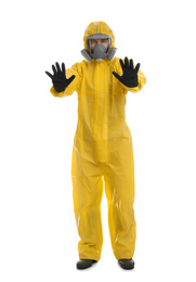 Photo of Man wearing chemical protective suit showing STOP gesture on white background. Prevention of virus spread