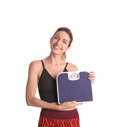 Photo of Young beautiful woman with scales on white background. Weight loss motivation