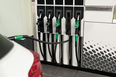 Refueling modern car at gas filling station, closeup