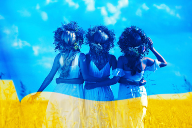 Double exposure of beautiful women with flower wreaths outdoors and Ukrainian flag 