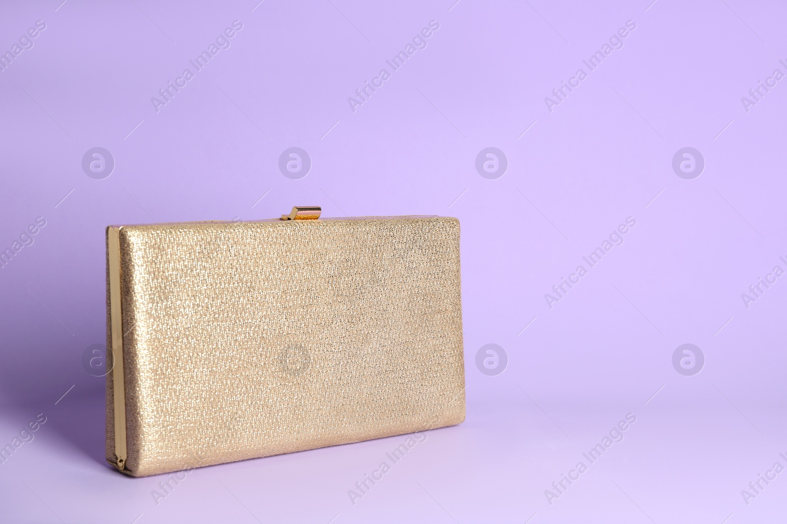 Photo of Stylish woman's bag on lilac background. Space for text