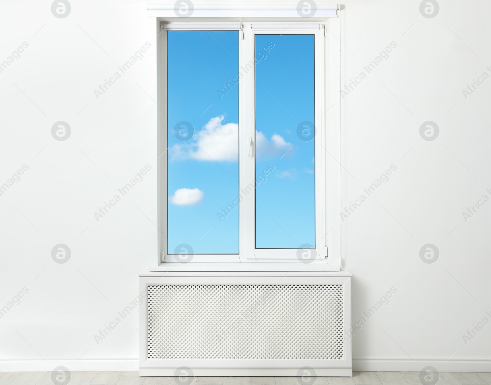 Image of Beautiful view on blue sky with clouds through window in room