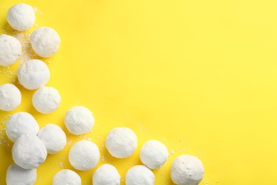 Snowballs on yellow background, flat lay. Space for text