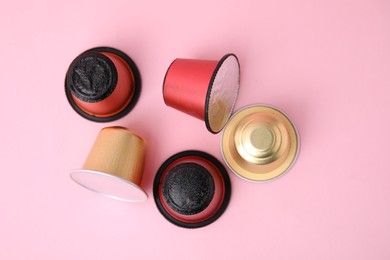 Photo of Many coffee capsules on pink background, flat lay