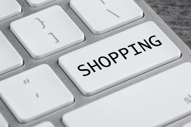 Online store. Button with word SHOPPING on computer keyboard, closeup