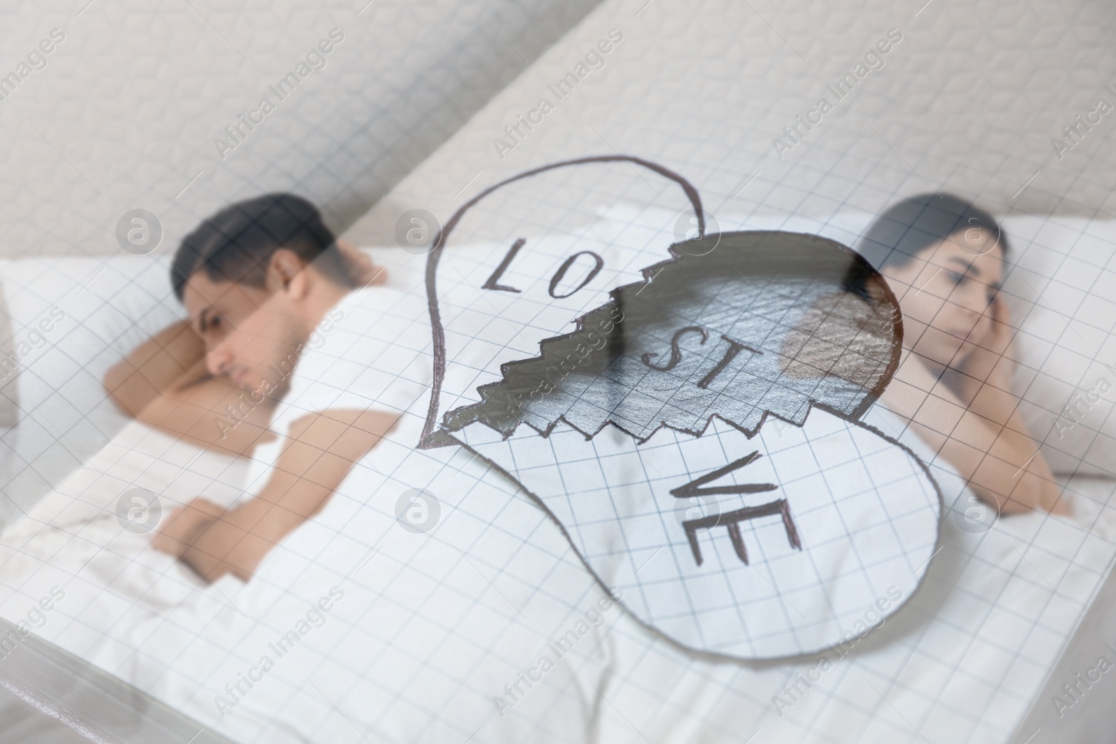 Image of Double exposure of unhappy couple with relationship problems in bed and broken paper heart