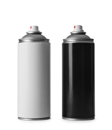 Photo of Cans of different spray paints on white background