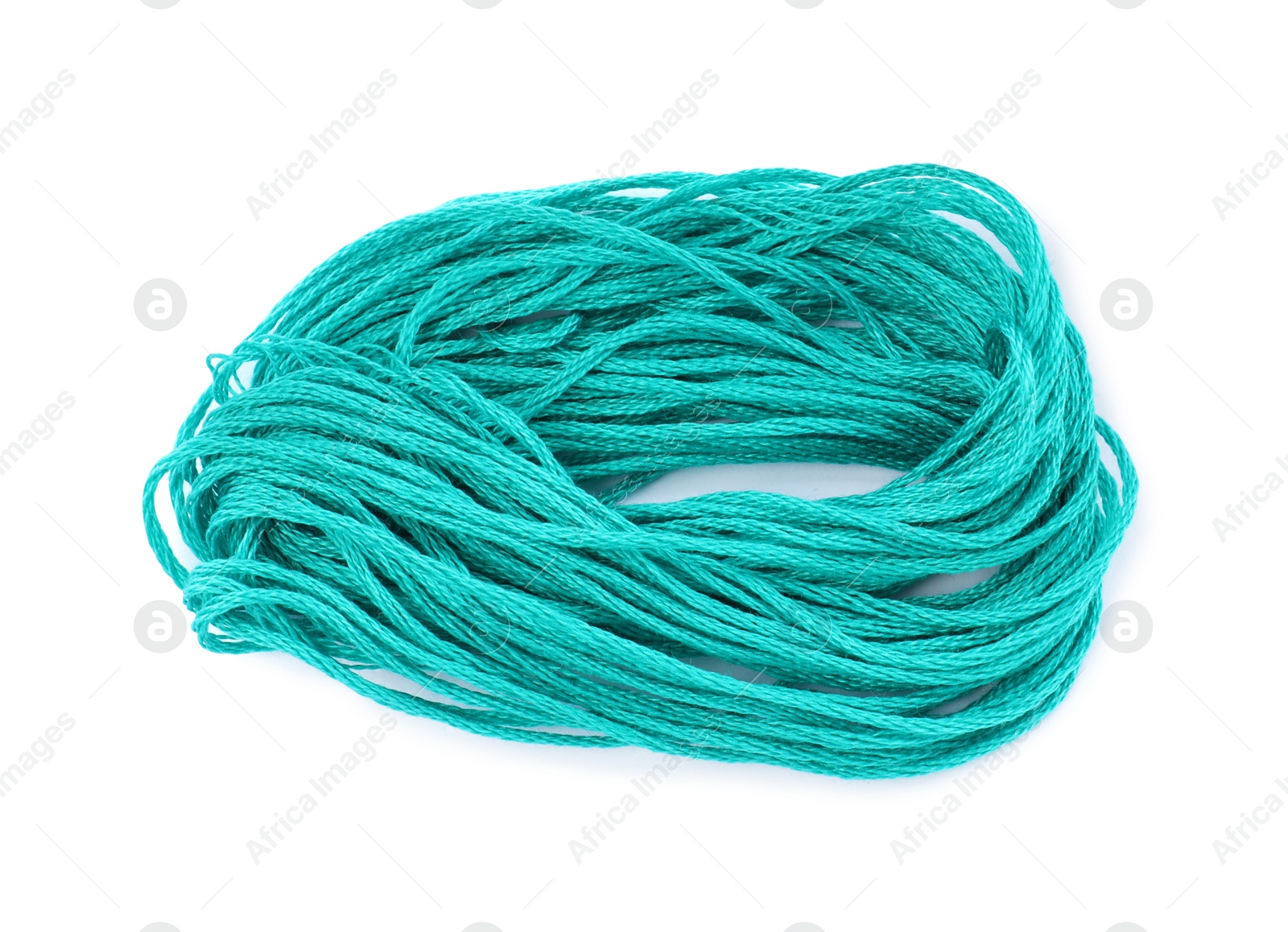 Photo of Bright turquoise embroidery thread on white background