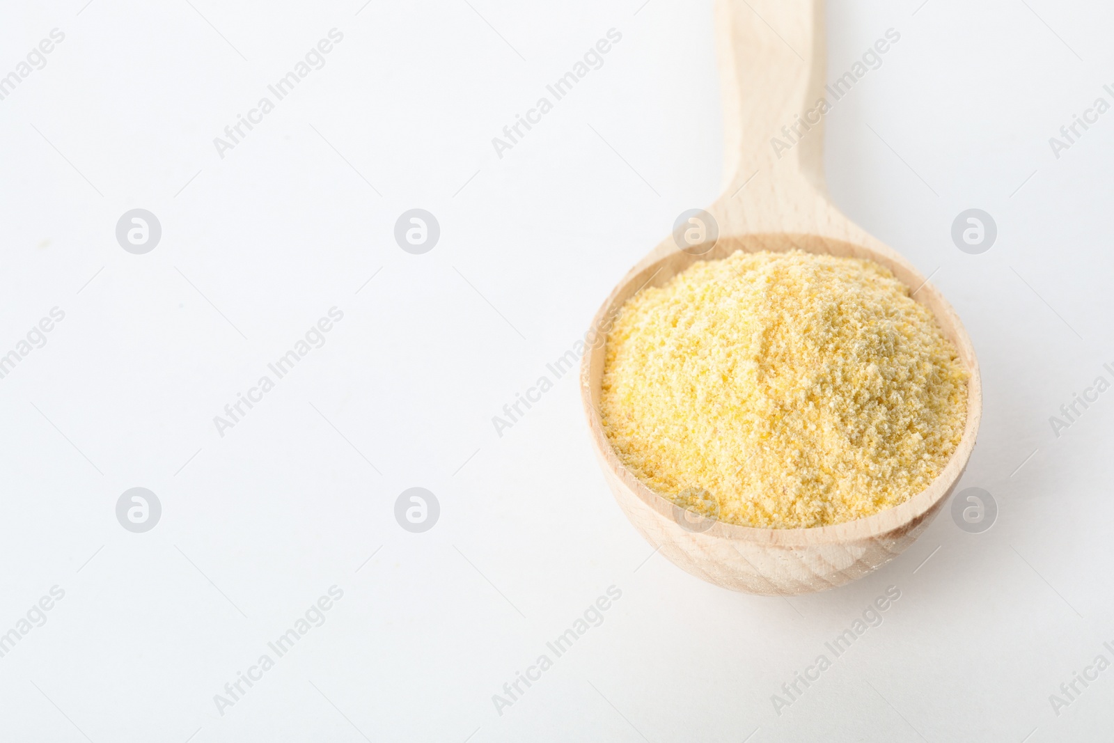 Photo of Spoon of corn flour isolated on white. Space for text