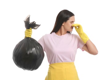 Photo of Woman holding full garbage bag on white background