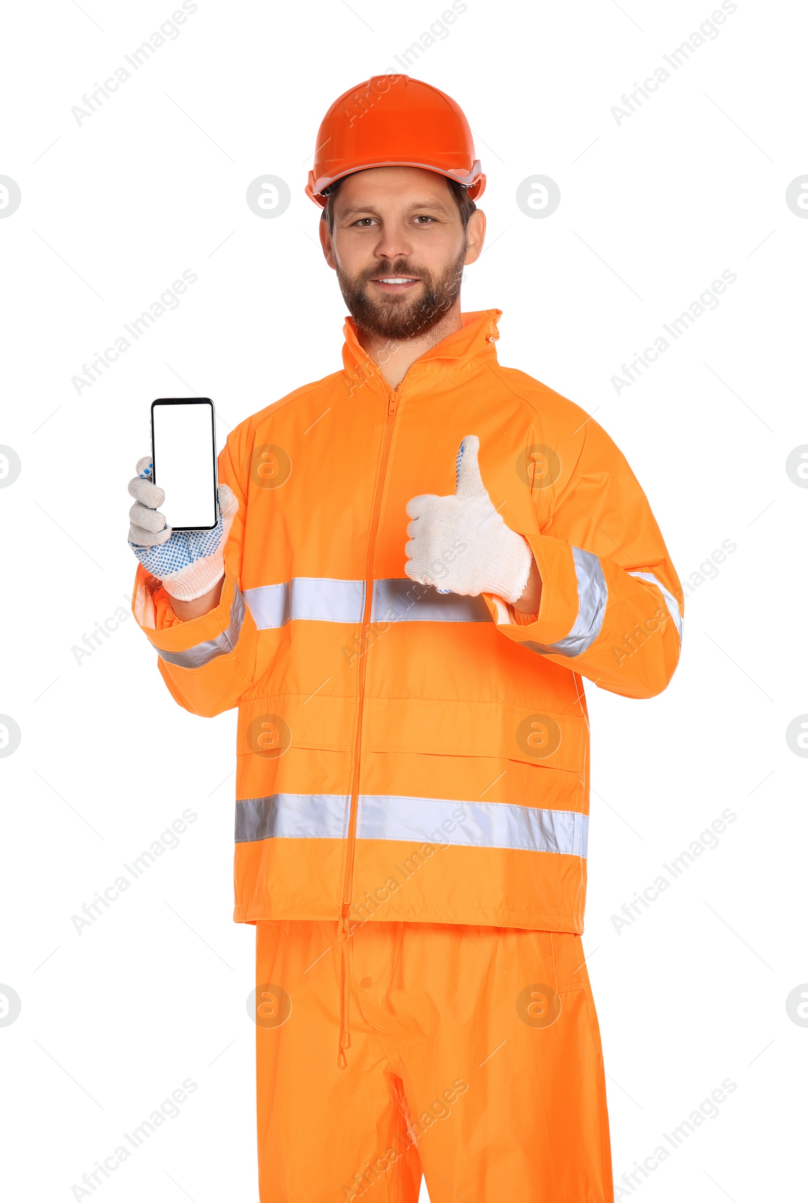 Photo of Man in reflective uniform showing smartphone and thumbs up on white background