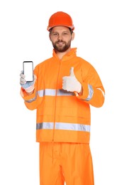 Man in reflective uniform showing smartphone and thumbs up on white background