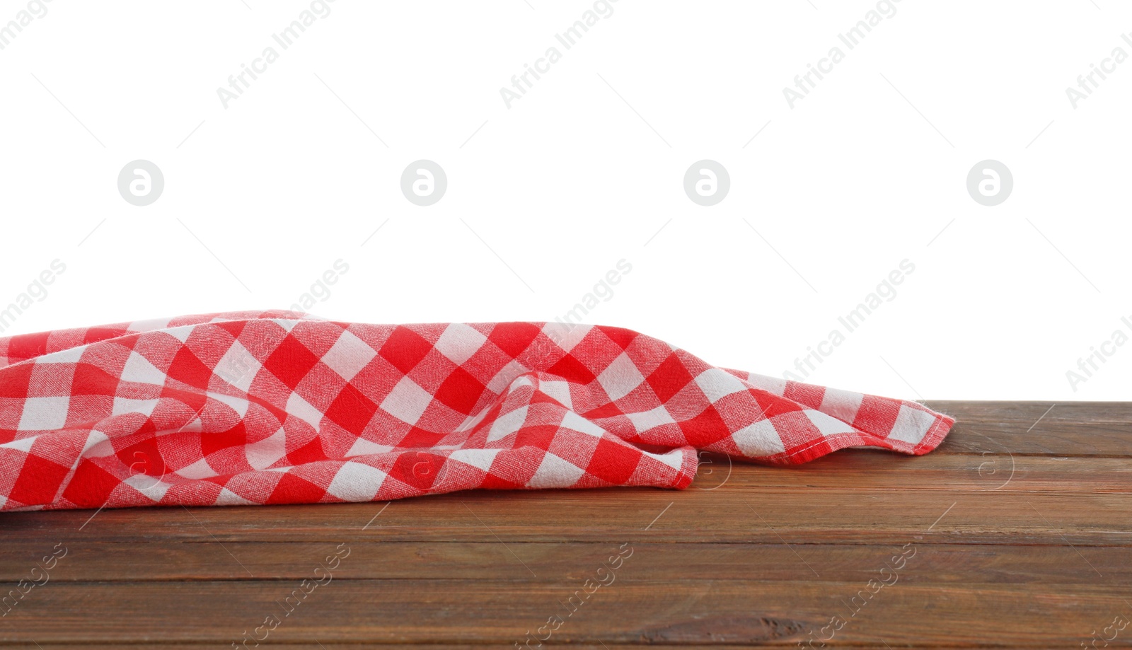 Photo of Red checkered cloth on wooden table against white background. Mockup for design