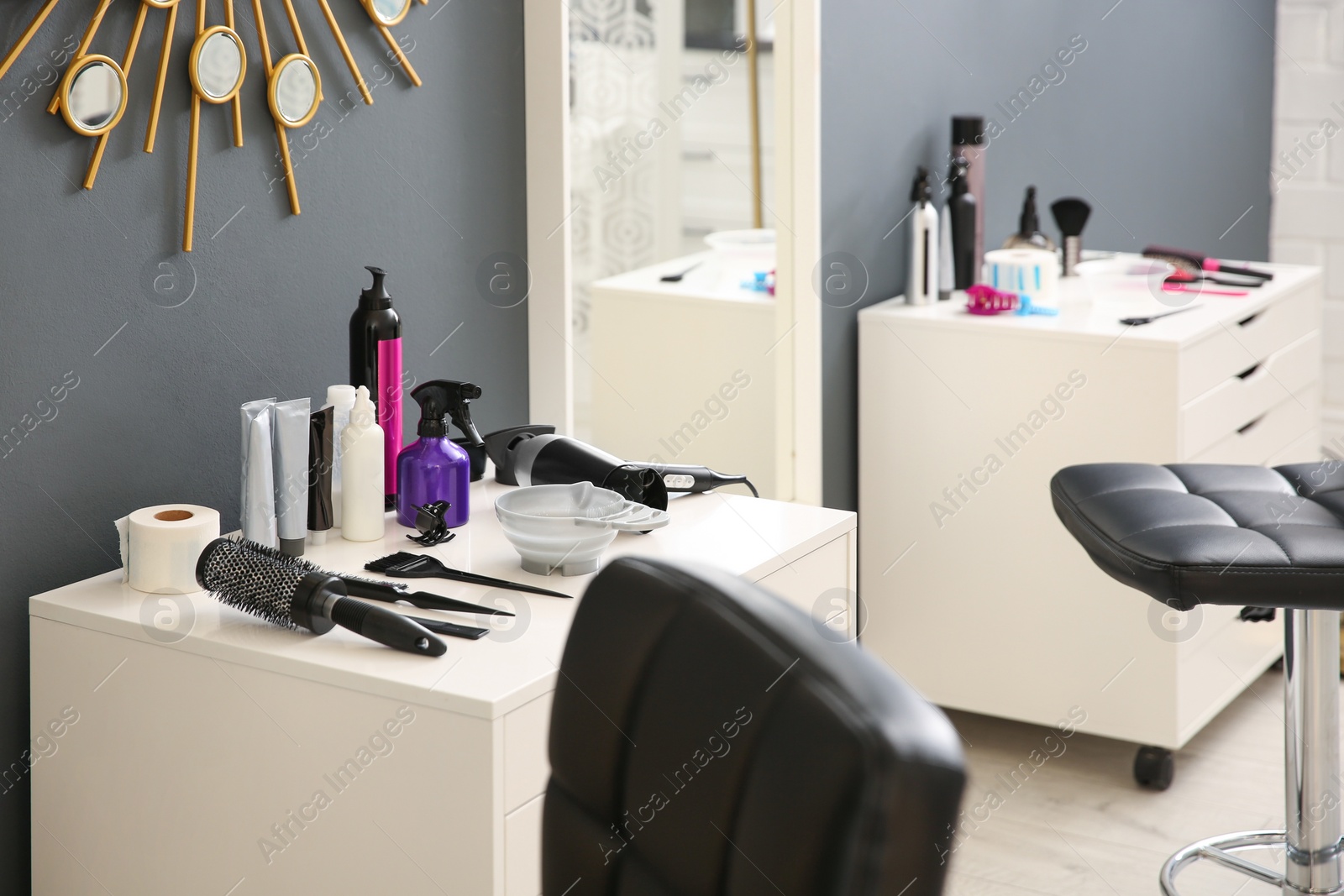 Photo of Workplace with hair dye kit in beauty salon