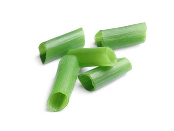 Photo of Pieces of fresh green onion on white background