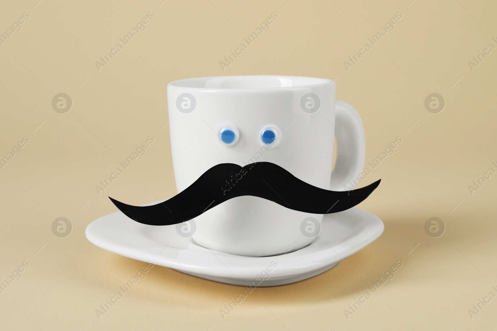 Photo of Man's face made of fake mustache, cup and eyes on beige background