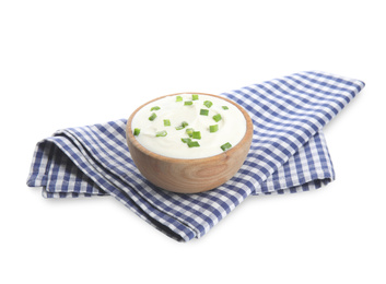 Photo of Fresh sour cream with onion and fabric on white background