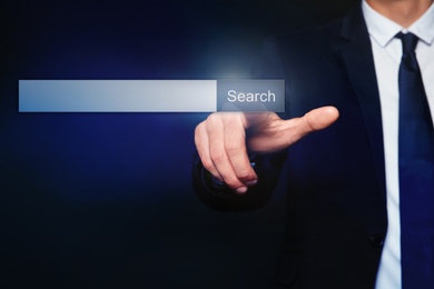 Image of Businessman using search bar on virtual screen, closeup