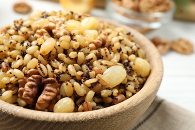 Traditional Christmas slavic dish kutia in bowl on table, closeup