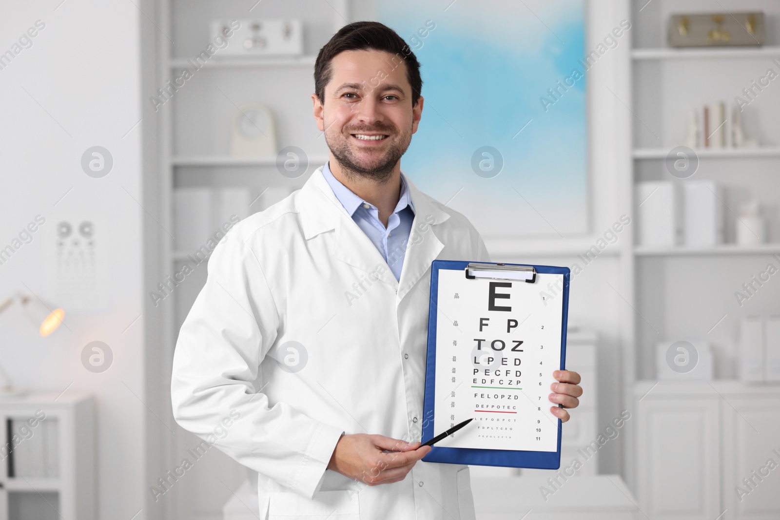 Photo of Ophthalmologist pointing at vision test chart in clinic