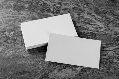Photo of Blank business cards on grey background. Mockup for design