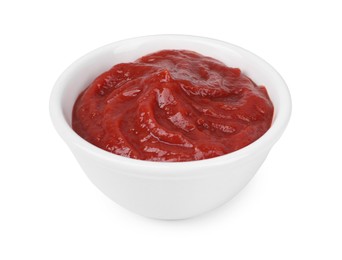 Photo of Organic ketchup in bowl isolated on white. Tomato sauce