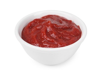 Organic ketchup in bowl isolated on white. Tomato sauce